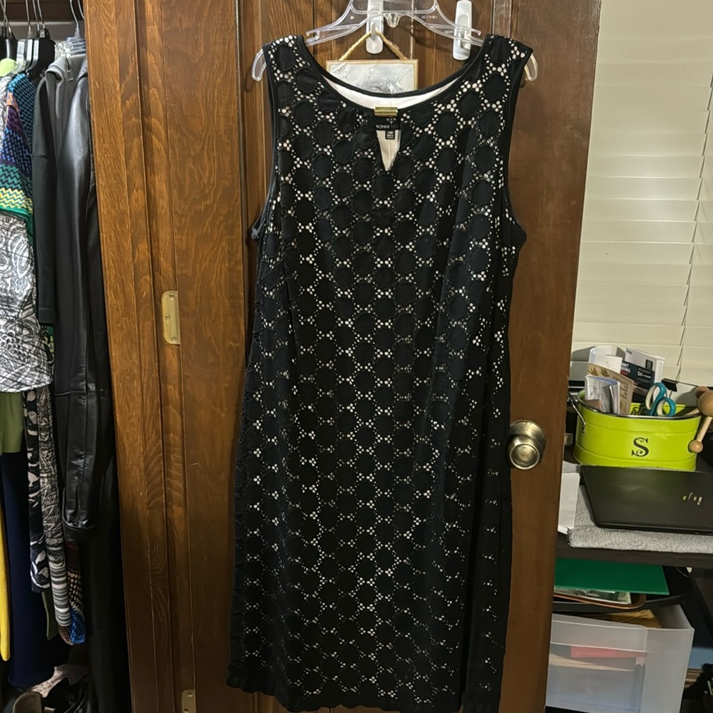 Sleeveless back slip with nude liner. Perfect for formal events. Knee length.